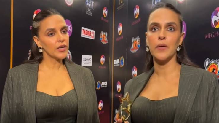 Neha Dhupia lashes , paparazzi,  posting back shots."